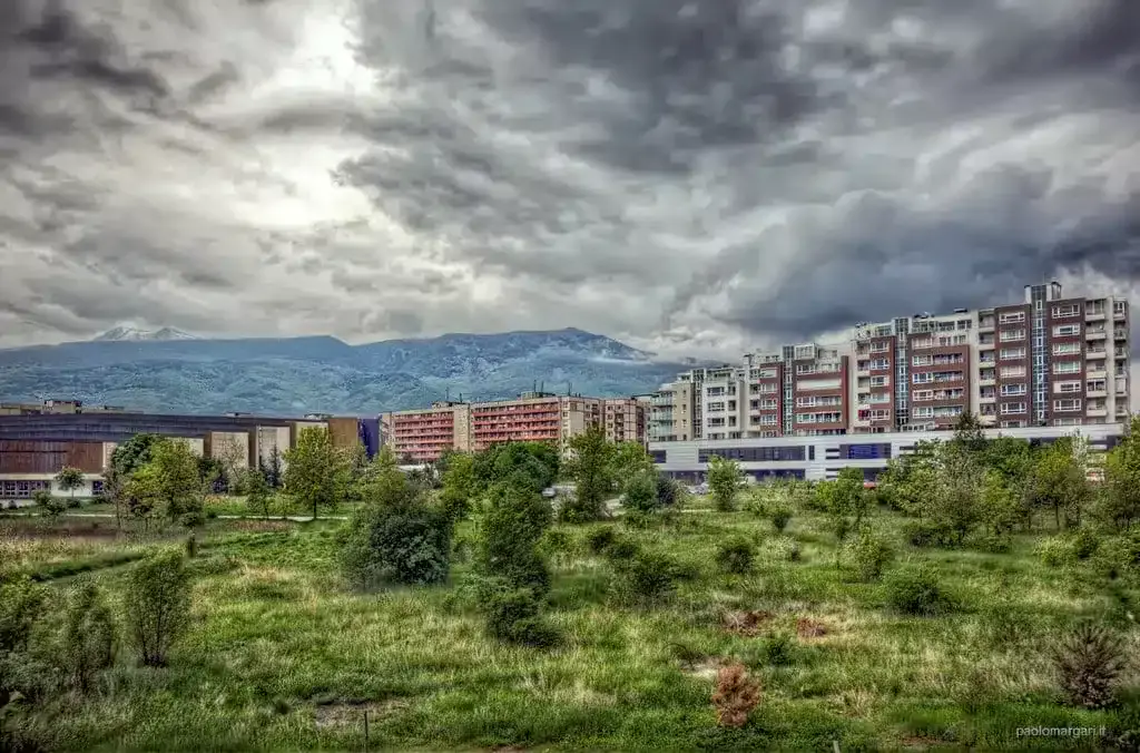 Overcast day over a city with modern apartment buildings, an